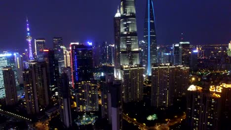 T/L-AERIAL-shot-of-Shanghai-cityscape-and-skyline-at-night/Shanghai,China