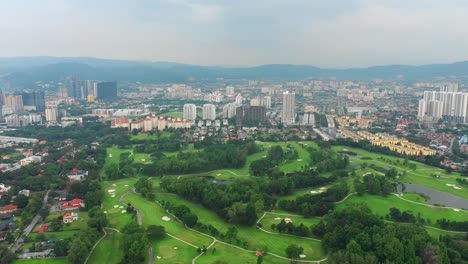 evening-kuala-lumpur-cityscape-golf-club-course-aerial-panorama-4k-malaysia