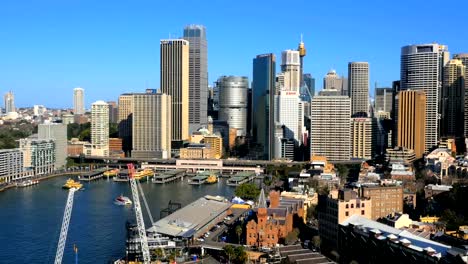 Panning-aerial-shot-of-Sydney-CBD-and-Sydney-Harbour-(4K/UHD-to-HD)