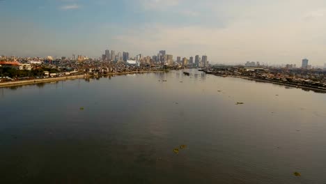 Aerial-city-with-skyscrapers-and-buildings.-Philippines,-Manila,-Makati