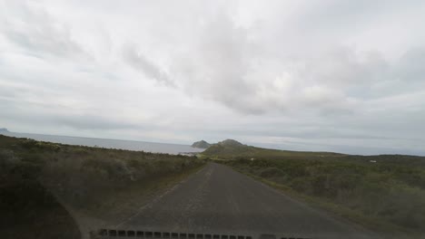 Driving-along-the-southern-coastline-in-the-Cape-Peninsula,-South-Africa.