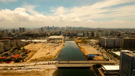 Luftbild-Stadt-mit-Wolkenkratzern-und-Gebäuden.-Philippinen,-Manila,-Makati