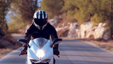 Man-riding-on-a-white-sports-motorcycle