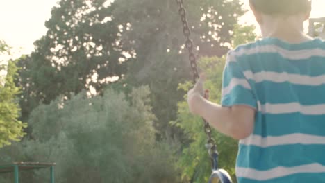 Children-swinging-together-at-a-public-playground