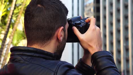 Man-photographing-the-Avenida-Paulista,-Sao-Paulo,-Brazil