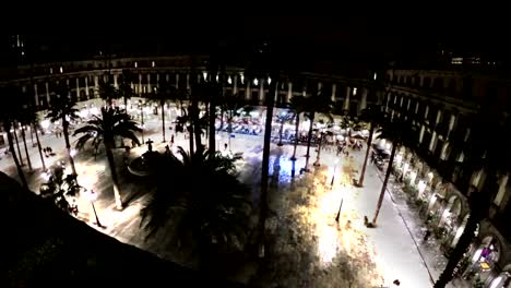 Night-view-of-Placa-Reial-with-restaurants.-Barcelona,-Spain