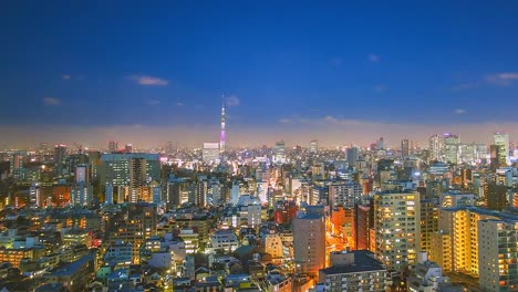 4K.-Vista-en-tiempo-de-lapso-de-la-ciudad-de-Tokio-en-Nigh-twith-torre-de-Tokio-en-Japón