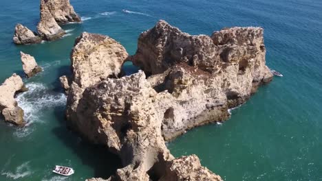 Aerial-view-of-Ponta-da-Piedade-rock-formations-in-Lagos,-Portugal