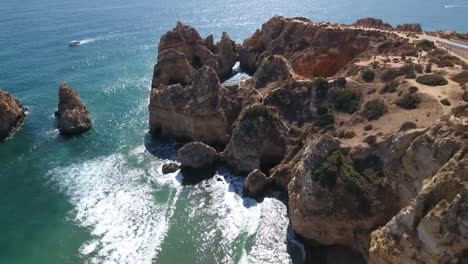 Aerial-view-of-Ponta-da-Piedade-rock-formations-in-Lagos,-Portugal