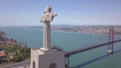 ciudad-de-Lisboa-Portugal-día-soleado-Cristo-Rey-panorama-aéreo-famoso-monumento-4k