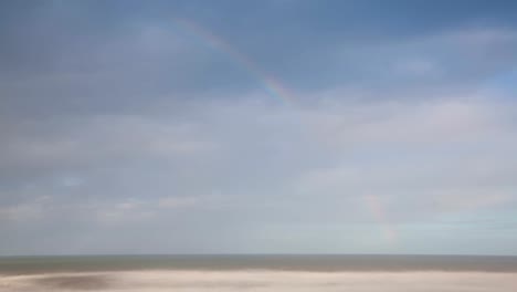 Rainbow-and-dramatic-sky-of-Atlantic-ocean-timelapse