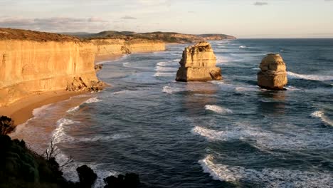 tilt-down-view-of-the-twelve-apostles-at-sunset-looking-east