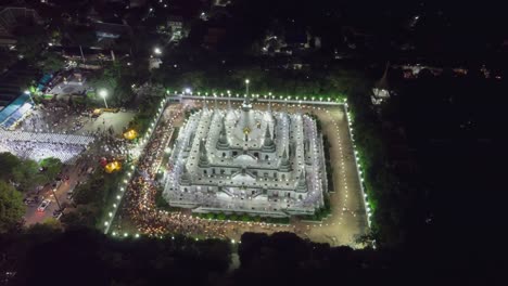 Aerial-time-lapse-view-over-big-pagoda-in-Asokaram-temple-in-Samutprakarn-near-Bangkok-Thailand-during-Asalha-Puja(Asanha-Bucha)Buddhist-festival-which-typically-takes-place-in-July,-on-the-full-moon.