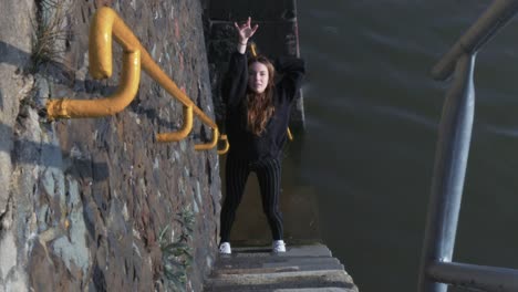 Young-Woman-Dancing-on-River-Steps