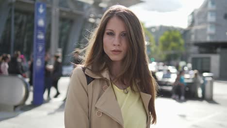 Young-adult-woman-enjoying-her-day-in-the-city-and-at-the-train-station