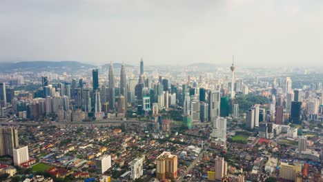 antena-centro-de-kuala-lumpur-día-soleado-panorama-timelapse-4k-Malasia