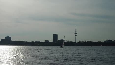 sailing-against-the-sun,-Binnenalster,-Hamburg,-Germany-V2