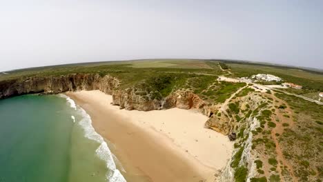 Aerial-video-footage-of-beautiful-bay-and-sandy-beach-of-Praia-do-Beliche-near-Cabo-Sao-Vicente,-Algarve-region,-Portugal