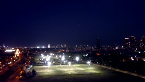 Tel-Aviv,-Israel,-Aerial-View-of-park-and-soccer-field-At-Night