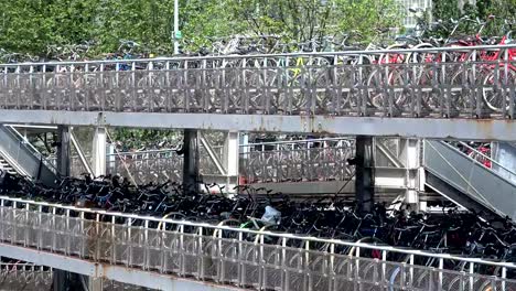 Bicycle-parking-space-in-the-city-of-Amsterdam,-a-cyclist-friendly-city,-4K