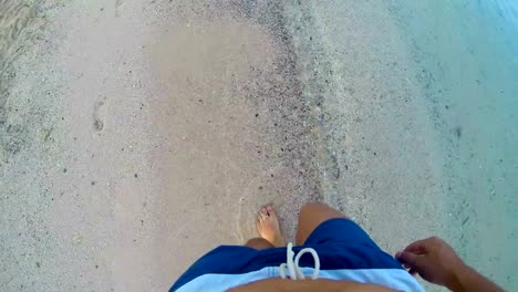 4k-lost-man-walking-on-sand-with--footsteps-in-sand,-POV-from-above