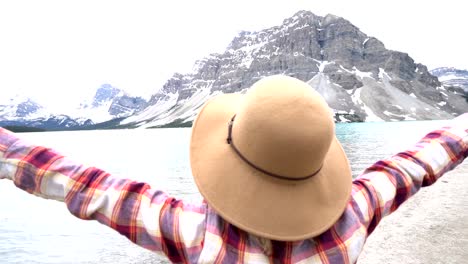 Woman-arms-outstretched-in-nature