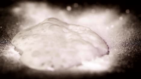 White-powder-on-top-of-the-paper.-Chemical-Reaction-Texture-Of-Bubbling-Powder.-Quenching-soda-vinegar-macro