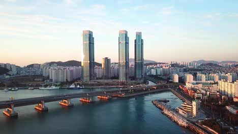 Gwangan-Bridge-and-Haeundae-aerial-view-at-Sunrise,-Busan,-South-Korea.