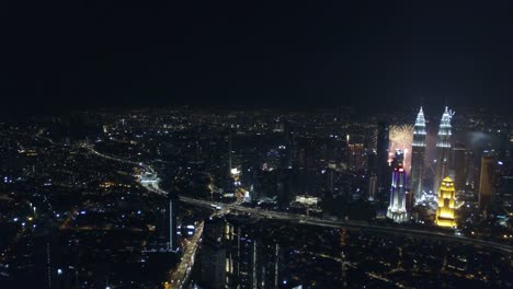 Aerial-view-of-Kuala-Lumpur-during-new-year-fireworks-near-KLCC-tower.