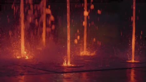 Slow-Motion-von-kleinen-bunten-Brunnen-in-der-Nacht