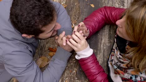 declaration-of-love-between-lovers-leaning-on-a-tree-trunk