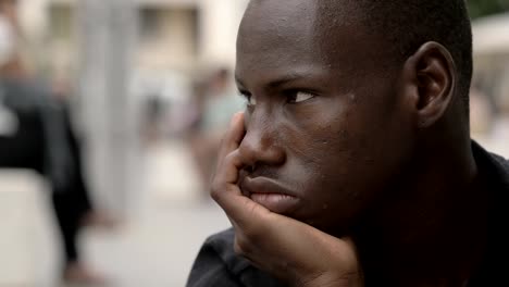 Thoughtful-young-black-african-man.-Thoughts,worries--outdoor