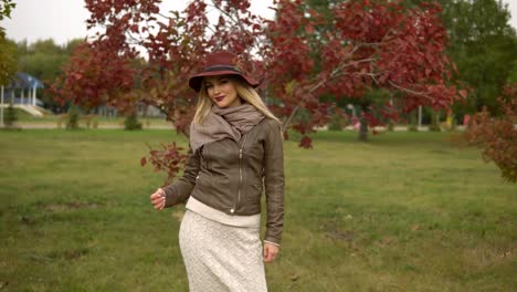 beautiful-blonde-girl-walking-in-the-park