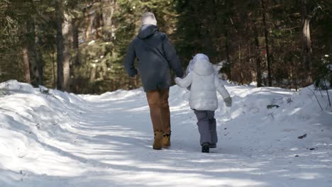 Brother-and-Sister-Running-in-Winter-Woods