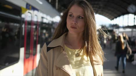 Young-Caucasian-woman-traveling-at-the-train-station