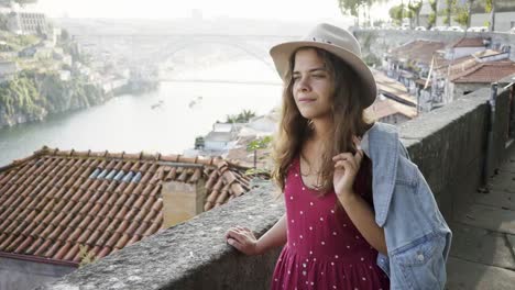 Pretty-woman-in-casual-wear-walking-on-street-of-Porto