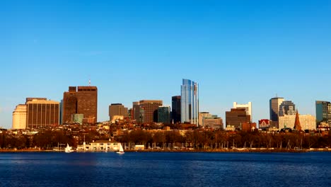 Timelapse-Boston-city-center-with-sailboats-in-foreground