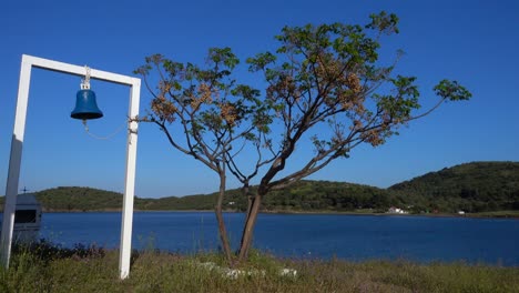 A-small-Greek-chapel-with-cross-near-Aegean-sea-in-Kassandra-peninsula-in-Greece