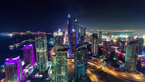 Dubai-marina-centro-noche-iluminación-techo-superior-panorama-4-tiempo-k-lapso-Emiratos-Árabes-Unidos