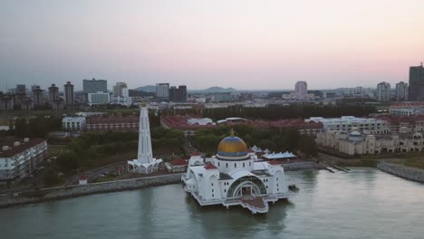 Aerial-Footage---Dawn-at-a-mosque,-The-Melaka-Straits-Mosque