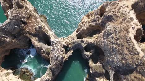 Aerial-view-of-Ponta-da-Piedade-rock-formations-in-Lagos,-Portugal