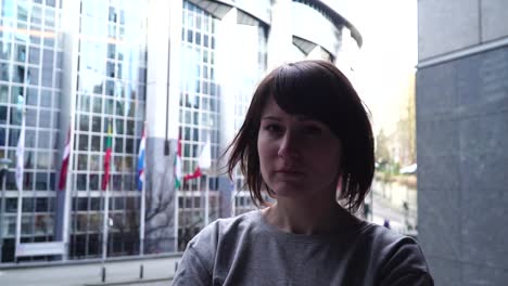 tourist-lady-walks-and-looks-at-attractions-near-the-European-Parliament-in-Brussels.-Belgium.-slow-motion