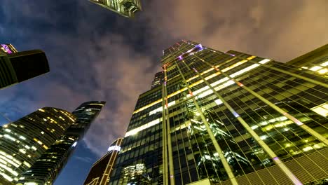 bottom-up-view-of-rotating-skyscrapers-and-flying-clouds,time-lapse,-hyper-lapse