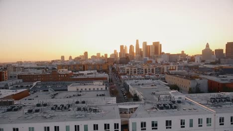 Aerial-shot-over-buildings-in-Downtown-Los-Angeles-during-sunset