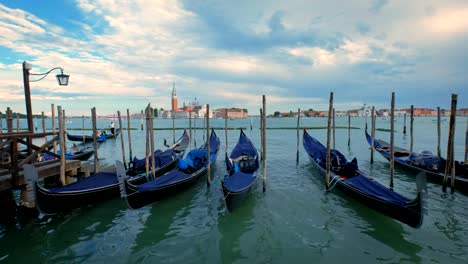 Gondolas-in-lagoon-of-Venice,-Italy