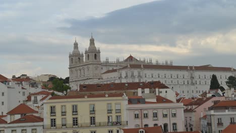 Time-lapse-of-Sao-Vicente-da-Fora-Church-in-Alfama,-Lisbon,-Portugal.-Captured-at-Miradouro-Porta-do-Sol