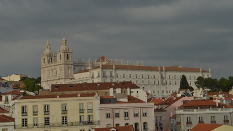 Time-lapse-of-Sao-Vicente-da-Fora-Church-in-Alfama,-Lisbon,-Portugal.-Captured-at-Miradouro-Porta-do-Sol