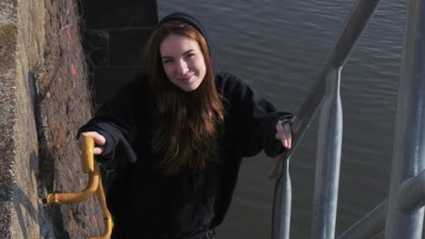 Young-Woman-Standing-on-River-Staircase