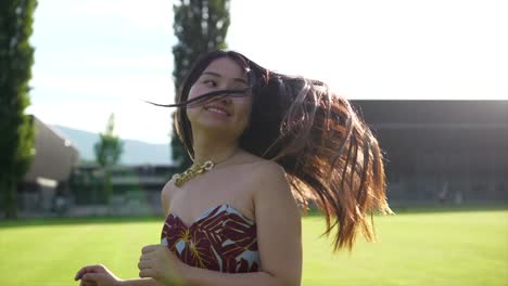 Beautiful-and-carefree-Asian-lady-having-a-relaxing-day-outside