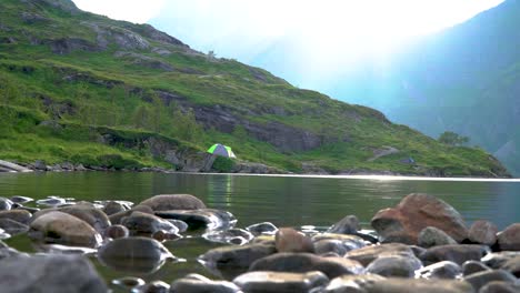 Tourists-and-tent-near-the-lake